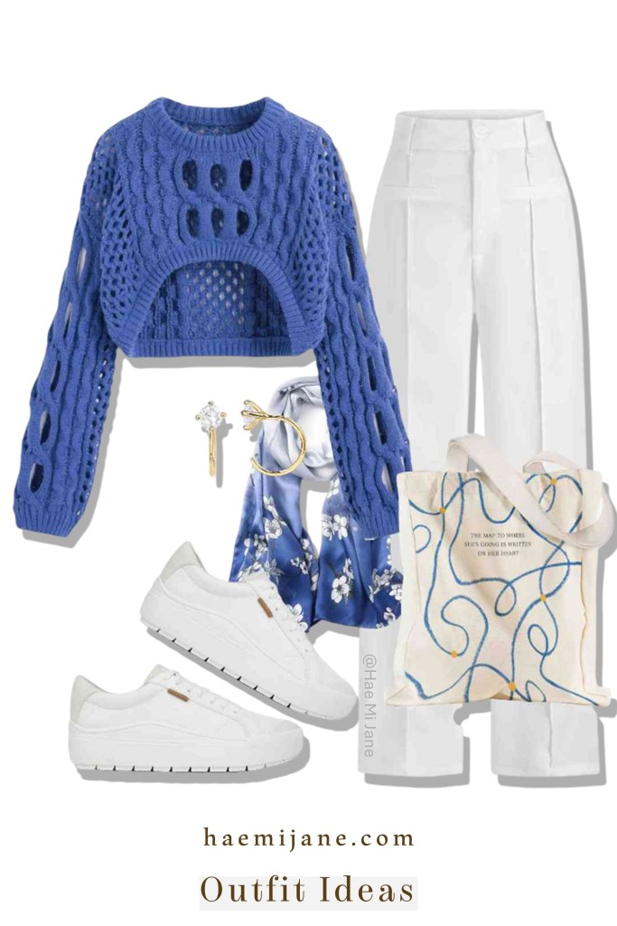 A curated outfit display including a vibrant cobalt blue open-knit cropped sweater, high-waisted white trousers, white platform sneakers, a blue and white floral silk scarf, and a patterned cream tote bag